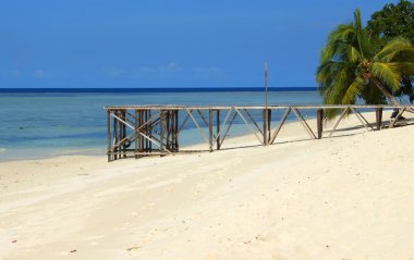 Sipadan island beach and pier clipart