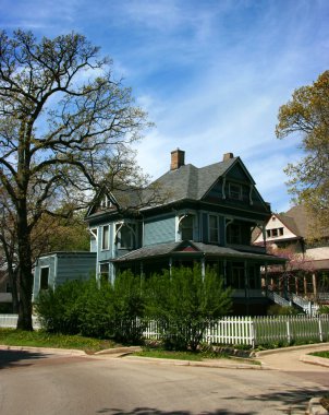 Wooden cyan house in Oak Park clipart