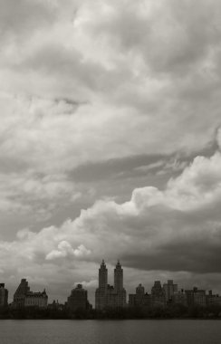 Dark clouds over Central Park Reservoir clipart