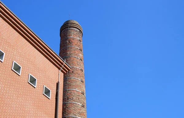 Brick building and smokestack — Stock Photo, Image