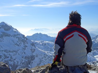 Man looking over mountains top clipart