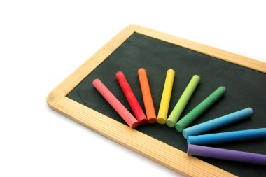 Blackboard and chalks in rainbow clipart