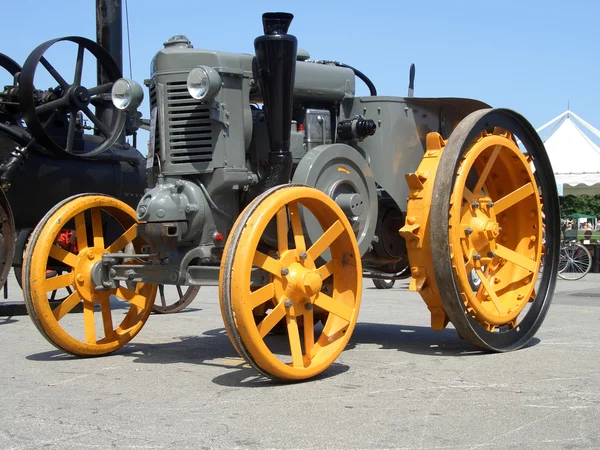 Older yellow grey tractor, front side — Stock Photo, Image