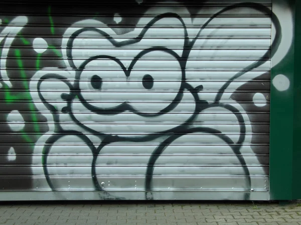 Rollladen mit Graffiti-Katze — Stockfoto