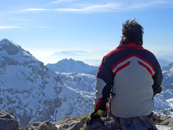 stock image Man looking over mountains top