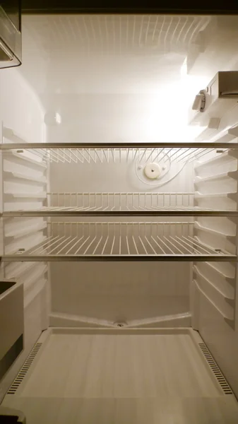 stock image Empty fridge interior, frontal view