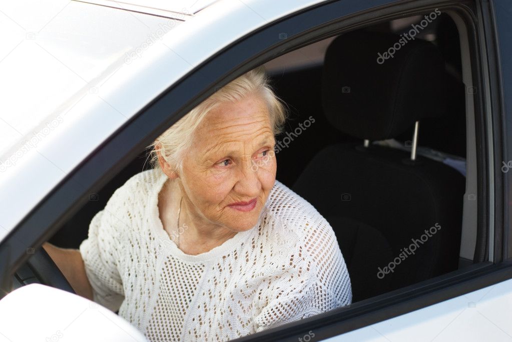 Elderly woman in the car