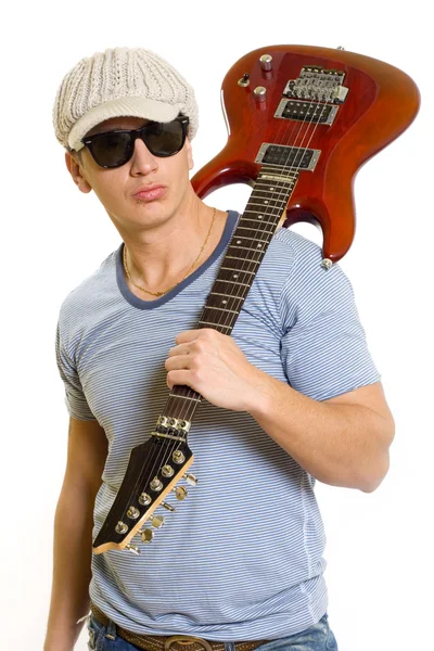 Guitarist with guitar on his shoulder — Stock Photo, Image