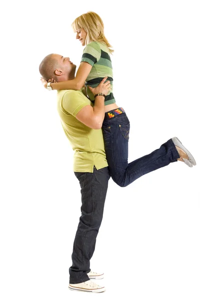 Man holding his girlfriend in the air — Stock Photo, Image