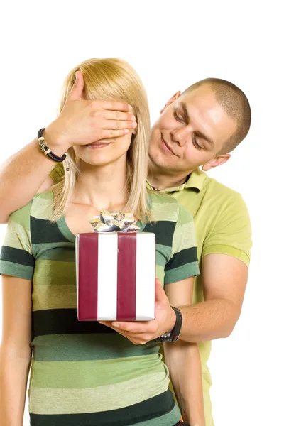 Man surprising a woman with present — Stock Photo, Image