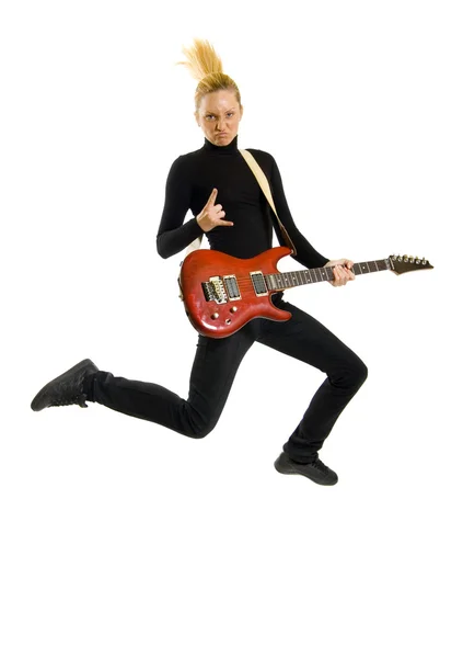 Headbanging kobieta gitarzysta skoki — Zdjęcie stockowe