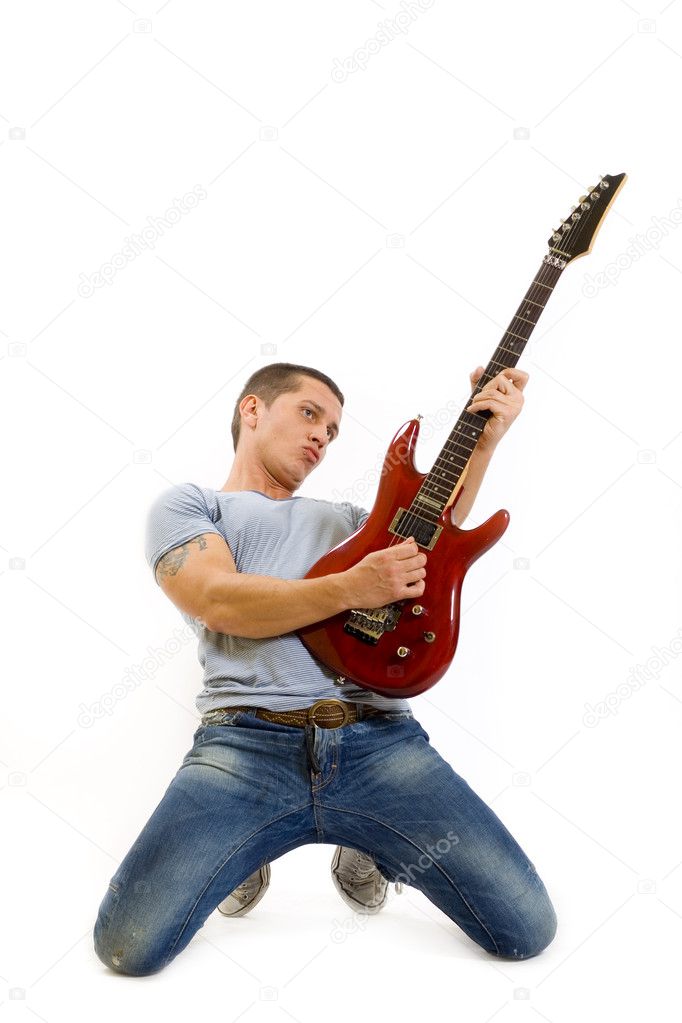 Guitarist playing guitar on knees
