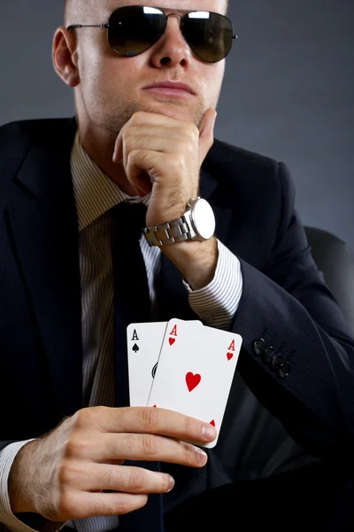 Businessman holding a poker hand — Stock Photo, Image