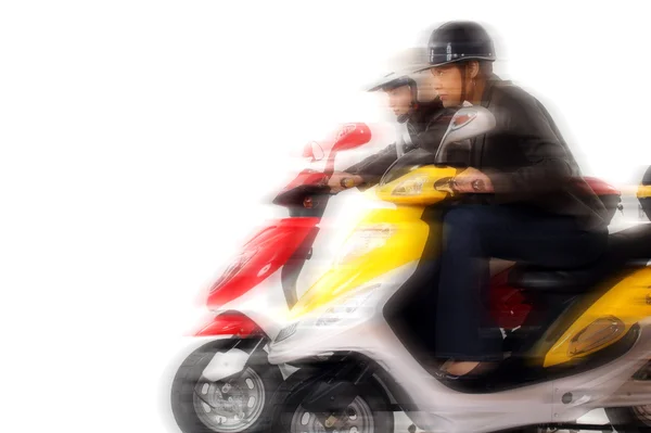 Couple girls racing on electric scooter — Stock Photo, Image