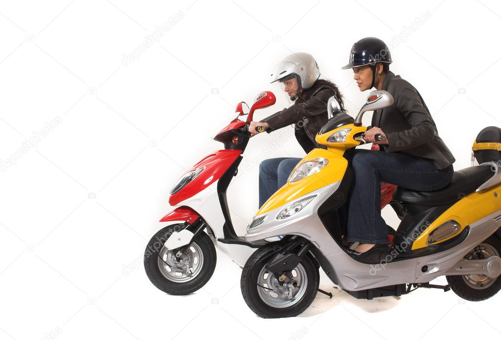 Couple girls racing on electric scooter