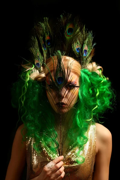 Fashion girl-peacock with green hair Stock Photo