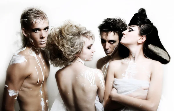 Four fashion models on the white backgro — Stock Photo, Image