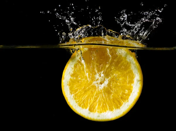 stock image Orange is splashing