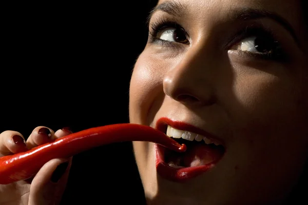 Hot woman with hot pepper — Zdjęcie stockowe