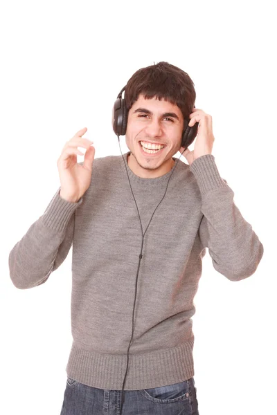 Ung man lyssnar musik — Stockfoto