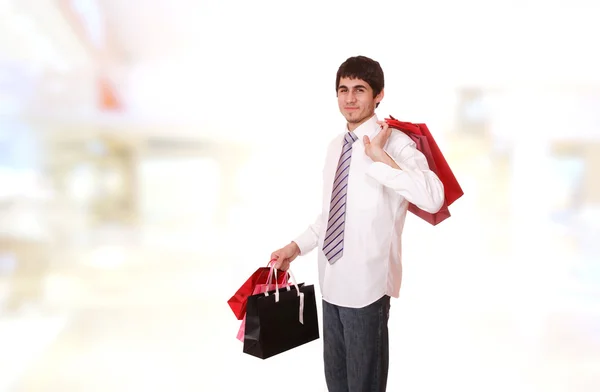 Schöner Mann mit Einkaufstaschen — Stockfoto