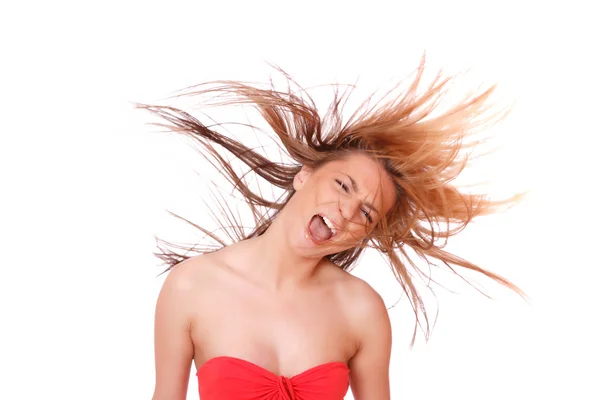 Young woman with her hair blowing an — Stock Photo, Image