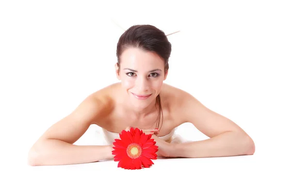 Woman with flower getting spa treatment — Stock Photo, Image