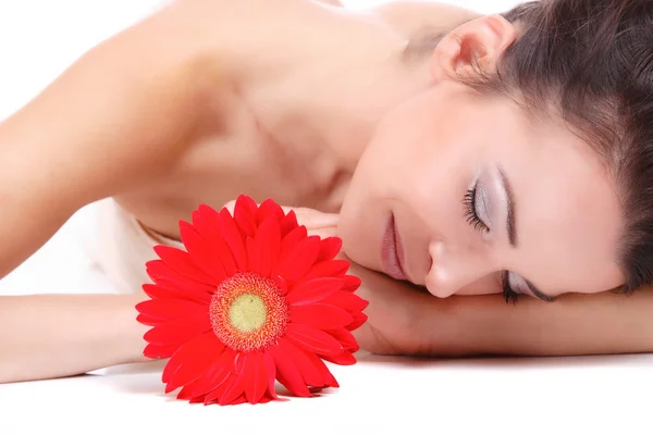 Жінка з квіткою лікує спа — стокове фото