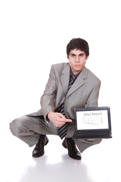 Affärsman som visar en laptop — Stockfoto
