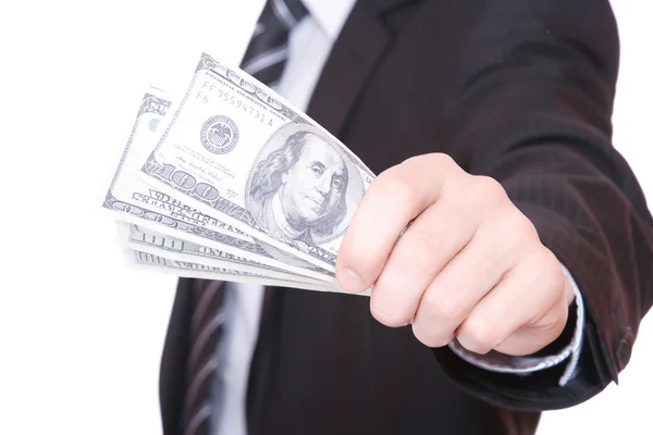 Affärsman håller pengarna i en hand — Stockfoto