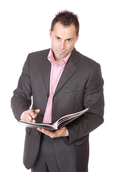 Selbstbewusster Geschäftsmann mit Notizbuch — Stockfoto