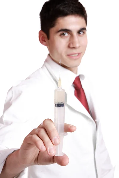 Lékař drží injekční stříkačku — Stock fotografie