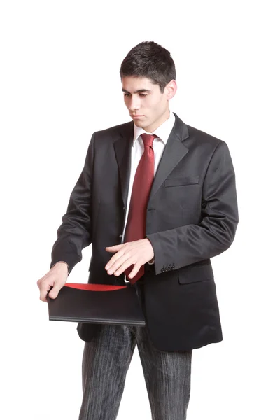 Уверенный бизнесмен с ноутбуком — стоковое фото