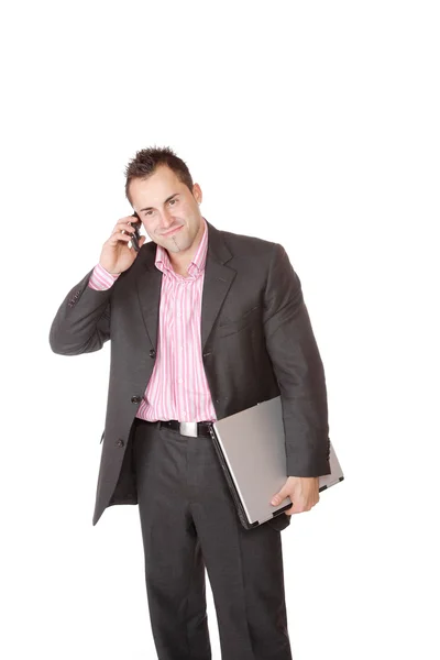 Happy businessman holding laptop computer — Stock Photo, Image