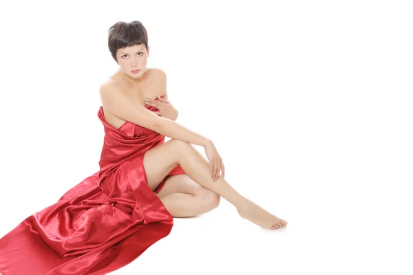 Mooi meisje in een lange rode jurk — Stockfoto