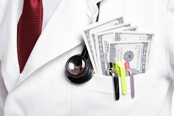 Doctor with 100 dollars bills — Stock Photo, Image