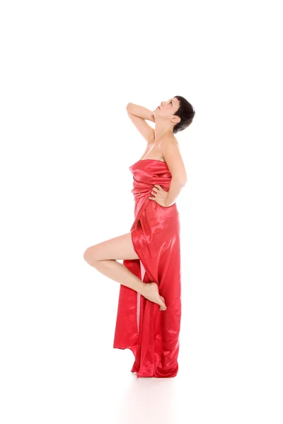 Mooi meisje in een lange rode jurk Stockfoto