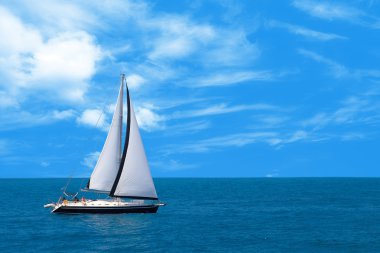 Sailboat sailing in the morning clipart