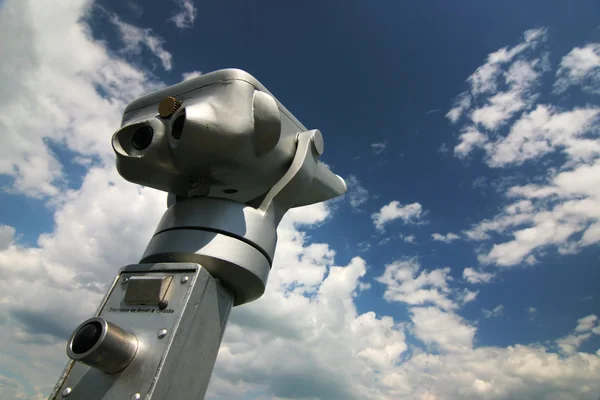 Metal binoculars with blue sky outdoor — Stock Photo, Image
