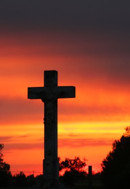 Crucifix with at sundown clipart