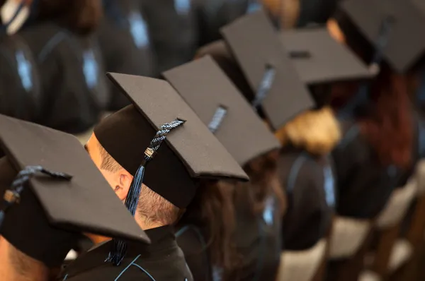 A group of students seated at graduation — Stock Photo, Image
