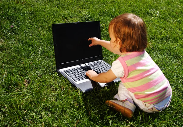 Child with laptop Royalty Free Stock Photos
