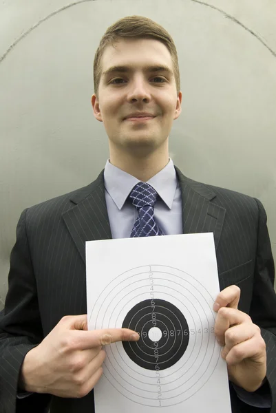 Young businessman pointing at the target — Stock Photo, Image