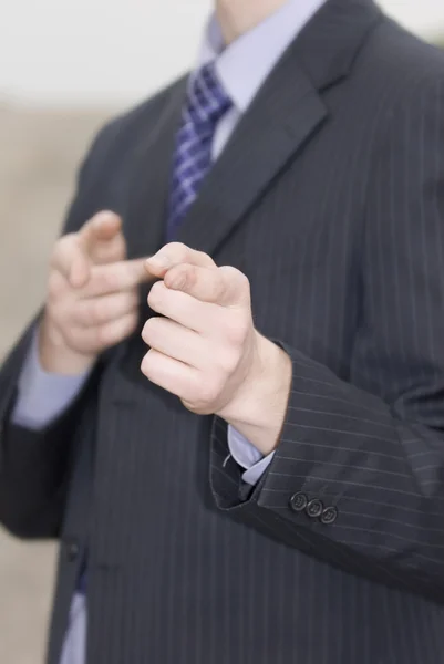 Businessman pointing fingers — Stock Photo, Image