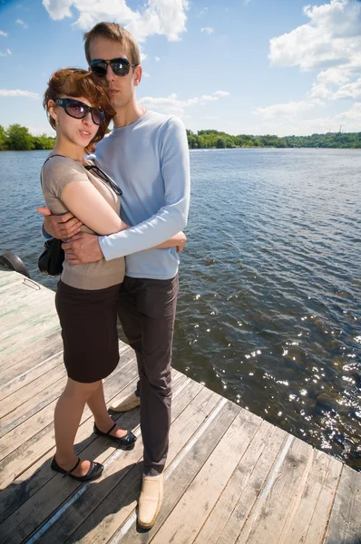 Young couple by the river — Stock Photo, Image