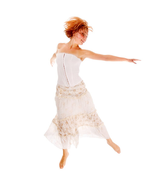 Red-haired dancer dancing isolated on white background