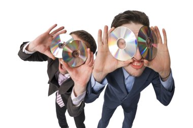 Two cheerful businessmen offering DVDs on sale clipart