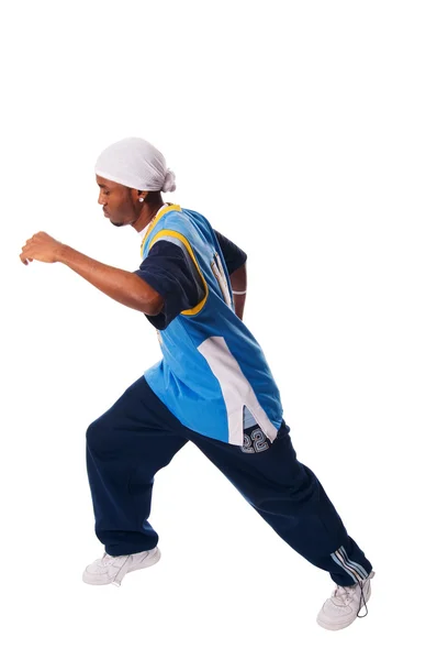 Hip-hop young man making cool move on white back — Stock Photo, Image