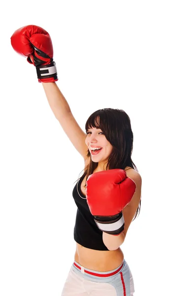 Fata care poartă mănuși de box cu o mână ridicată — Fotografie, imagine de stoc