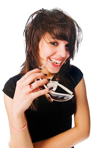 Happy girl with sunglasses in her mouth — Stock Photo, Image